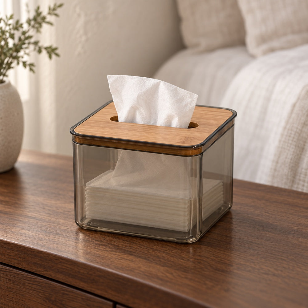 Cove bamboo-lid tissue holder with tissues on a warm bedside table