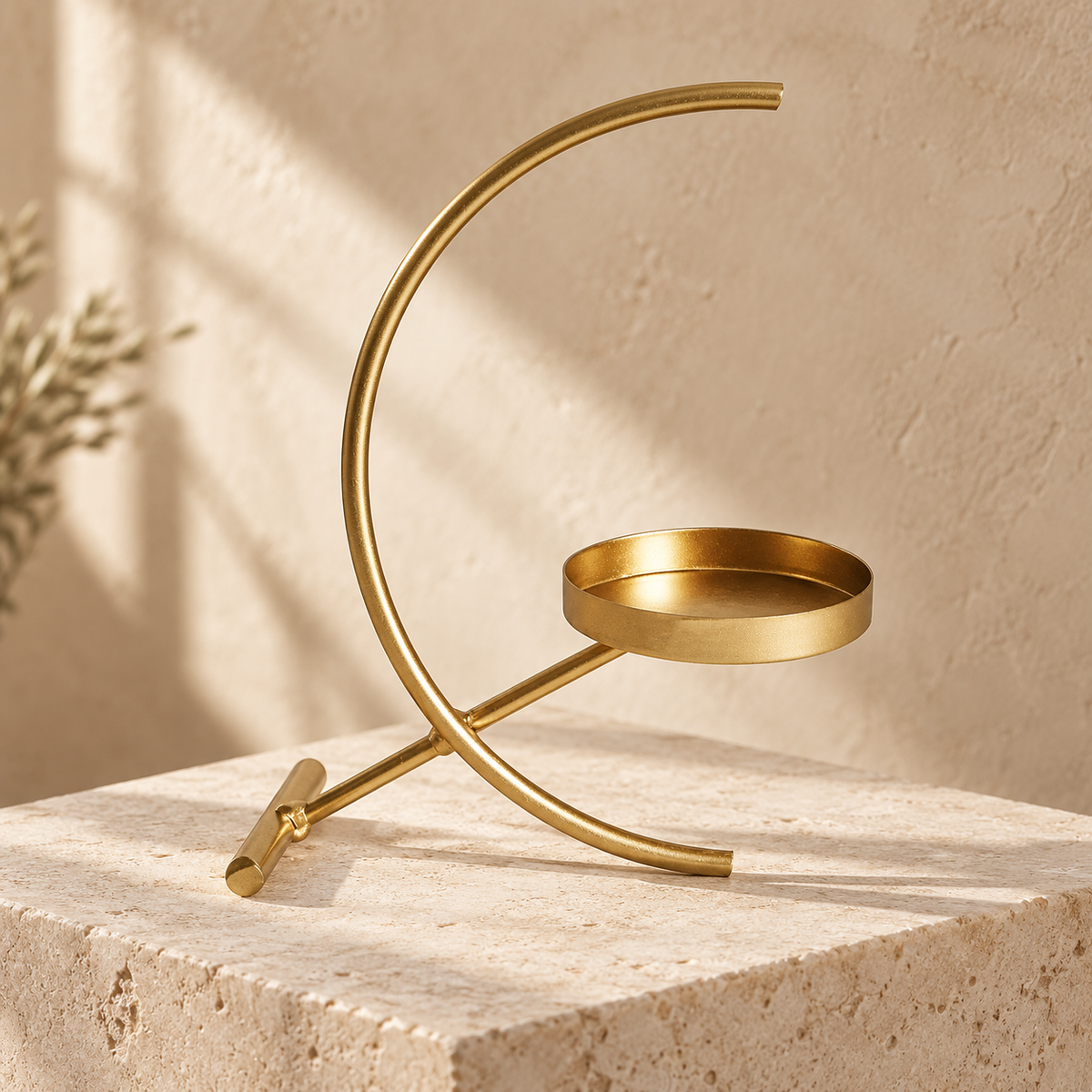 Crescent gold-tone tealight holder — hero view; candle and styling props not included
