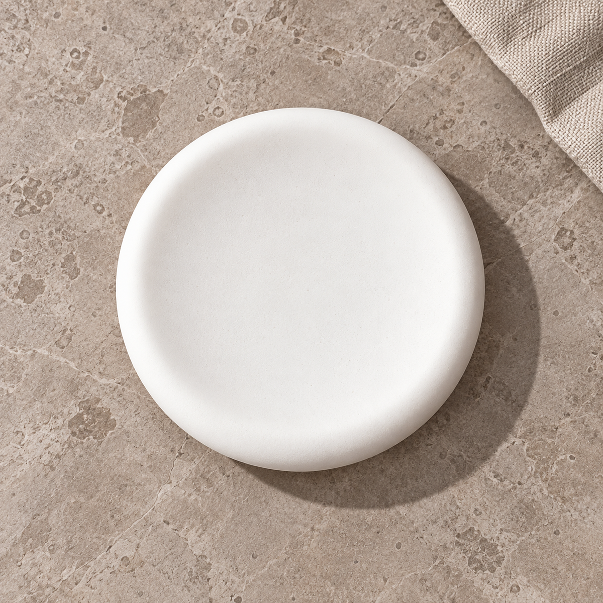 Overhead view of white round diatomite soap dish